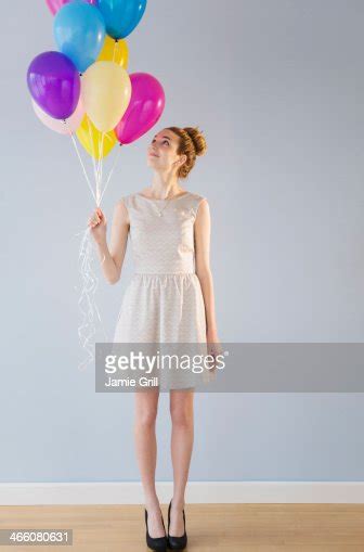 Woman Holding Bunch Of Balloons Photo Getty Images