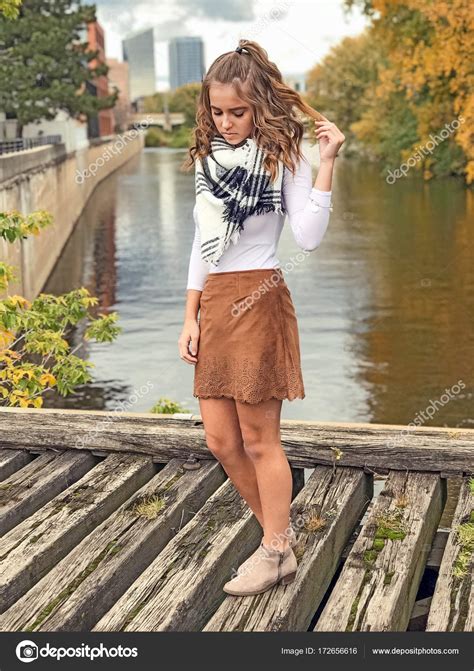 Teen Girl Wearing Short Skirt On Bridge — Stock Photo © Jentara 172656616