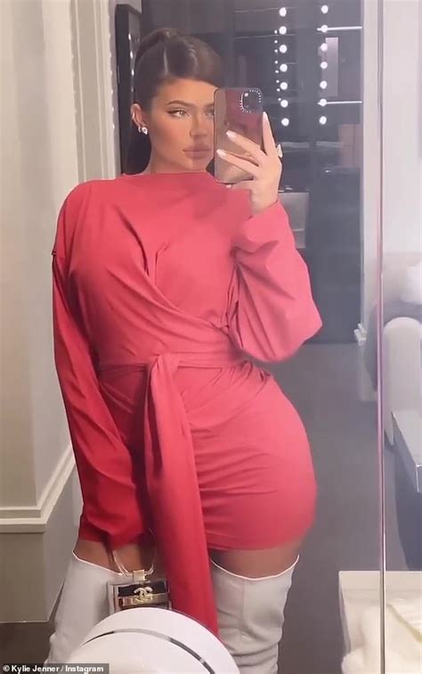 Kylie Jenner Opts For A Retro Look In A Pink Wrap Dress And White Thigh
