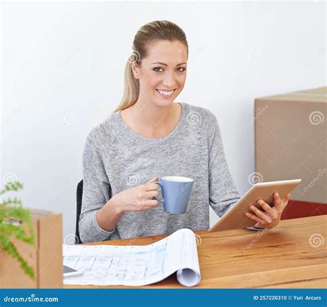 She Hasnt Even Unpacked...a Young Woman Sitting in Her New Office