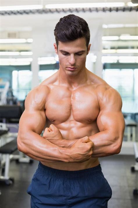 Shirtless Muscular Man Flexing Muscles In Gym Stock Photo Image Of