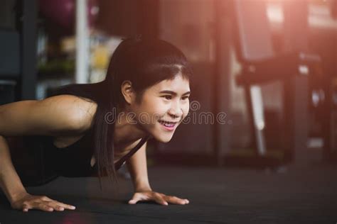 Asian Young Woman Doing Push Ups At The Gym Stock Photo Image Of