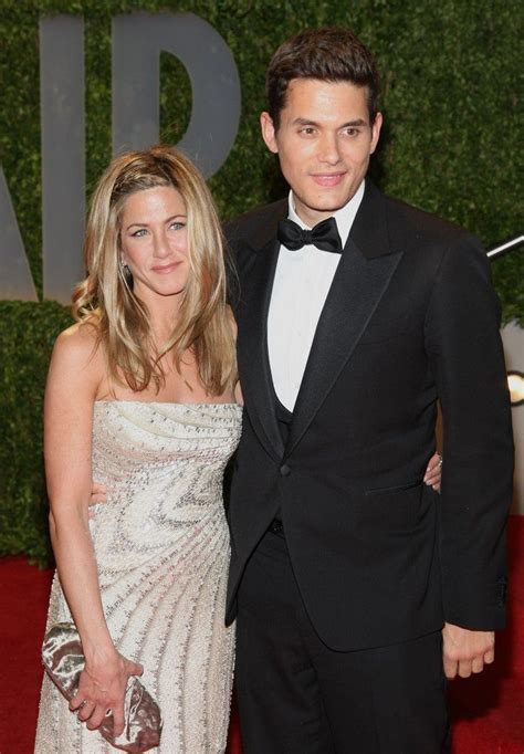 An Image Of A Man And Woman On The Red Carpet