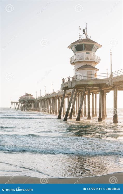Waves In The Pacific Ocean And The Pier In Huntington Beach Orange