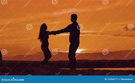 Man And Woman Spinning Hold Hands Silhouette Man And Girl Of A Happy Young Married Couple Slow