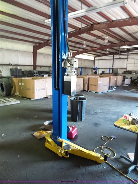 Before you first use your hoist, double check that all parts are tight, properly lubricated, and operating correctly. Revolution two post car lift in High Ridge, MO | Item BS9610 sold | Purple Wave