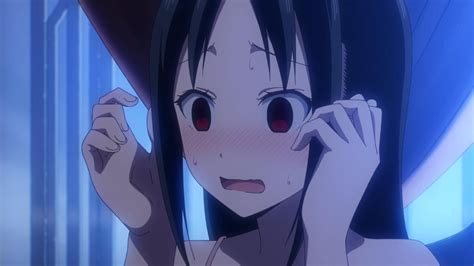 An Anime Character With Black Hair And Red Eyes Holding Her Hand Up To