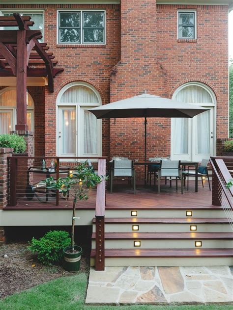 Brick house with white front porch railing | porch design. 13 World Class Decks in 2020 | Brick exterior house, Patio deck designs, Red brick house exterior