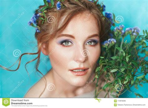 Young Girl With Blue Flowers On Light Blue Background Spring Beauty