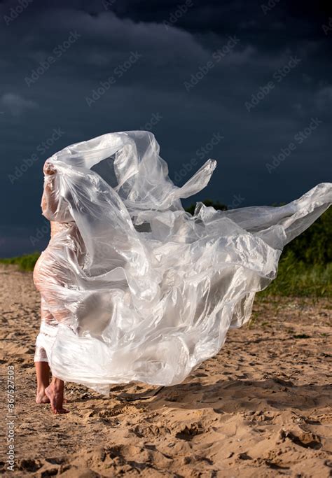 Babe Nude Woman Posing In Polyethylene Film Stock Photo Adobe Stock