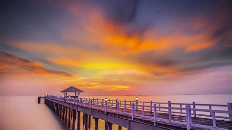 2560x1440 Ocean Pier Sunset 1440p Resolution Hd 4k Wallpapers Images