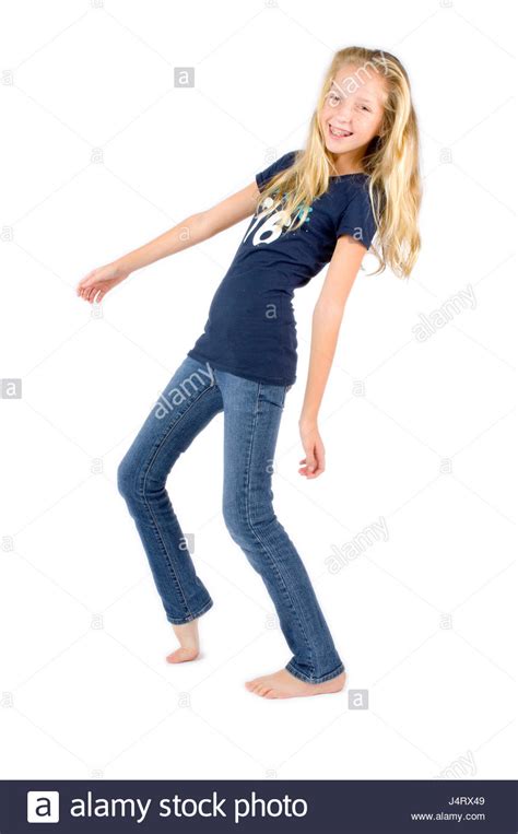 Preteen Girl With Blond Hair And Freckles Wearing Blue Jeans And A
