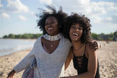 Two Black Women Laughing Outside Female Friendships Positive Routines