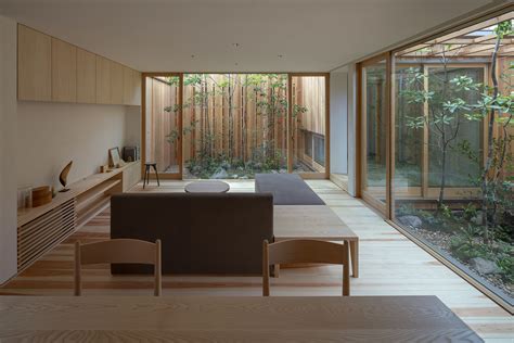 An Unconventional Wooden Home Structured Around Three Internal