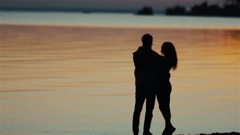 Slowmotion Couple Embracing At Sunset Stock Footage Video 100