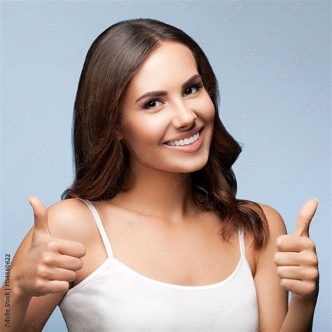 Woman Showing Thumbs Up Gesture Stock Photo Adobe Stock