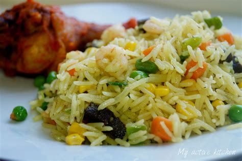 When the mixture is fragrant, about 15 seconds later, add the rice, breaking up clumps with a spoon as you go along and tossing it with oil. Nigerian Fried Rice - My Active Kitchen