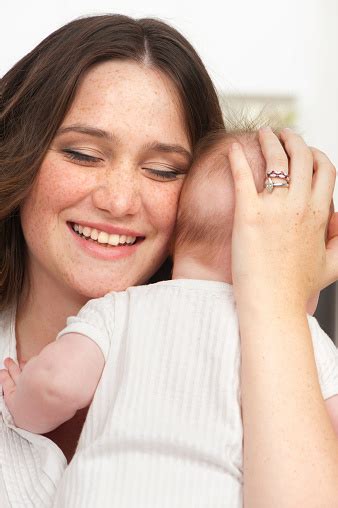 Happy Mother Holding Her Baby Girl Stock Photo Download Image Now