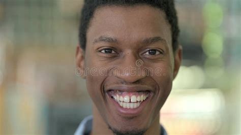 Close Up Of Happy Young African Man Looking At The Camera Stock Image