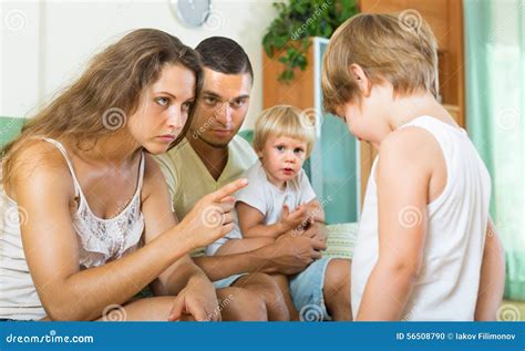 Parents Scolding Child In Home Stock Photo Image Of Maternity Berate