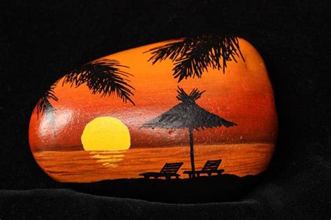 Painted Rockstone Setting Sun On A Tropical Beach Of The Caribbean