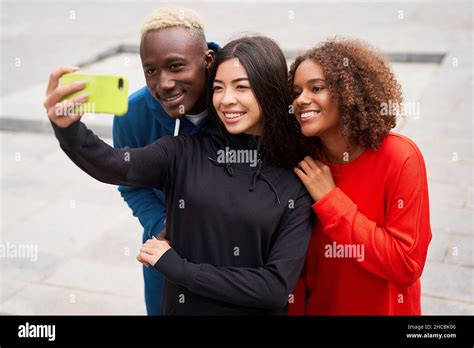 Multi Ethnic Friends Outdoor Taking A Selfie On Smartphone Diverse