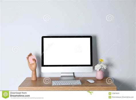 Modern Computer Monitor On Desk Against Light Wall Stock Image Image