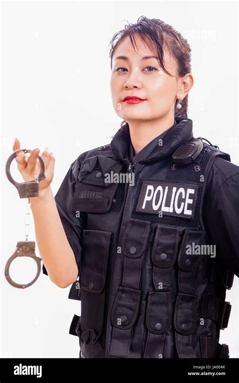 Chinese Female Police Officer Holding Handcuffs Stock Photo Alamy