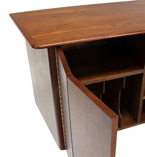 This sleekly tailored dresser makes a striking first impression with bold proportions, crisp, modern lines. Pair of HANGING Walnut Mid-Century Danish Modern Floating ...
