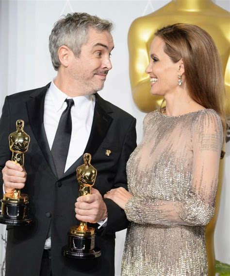 Gravity Director Alfonso Cuaron And Angelina Jolie Oscars 2014 Award Winner Angelina Jolie