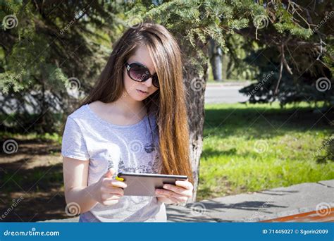 Long Haired Girl Enjoys The Tablet Stock Image Image Of Hair Online 71445027