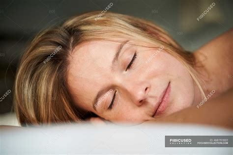 Portrait Of Blond Young Woman Lying Down With Closed Eyes — Dreaming