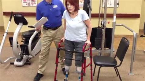 Double Amputee Standing Walking Across Gym To Sitting Physical Therapy