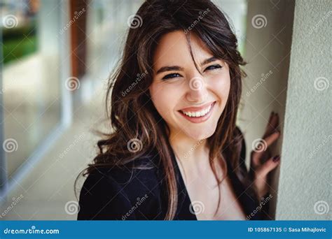 Portrait Of A Beautiful Brunette Laughing By The Wall Stock Image Image Of Laughing Jacket