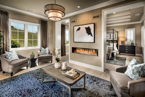 Contemporary fireplace in master bedroom sitting area. The Modern Dual Master Bedroom Trend in Luxury Homes