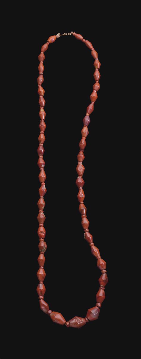 An Egyptian Red Jasper And Carnelian Bead Necklace New Kingdom