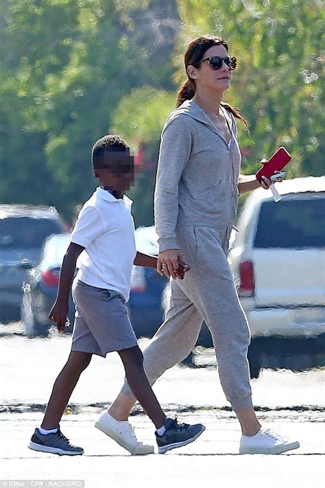 Sandra Bullock Gives Her Son Louis An Affectionate Pat Daily Mail Online