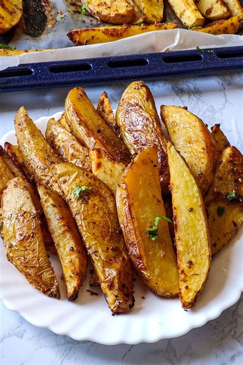 This post may contain affiliate links*. Baked Potato Wedges- an addictive, vegan and gluten-free ...
