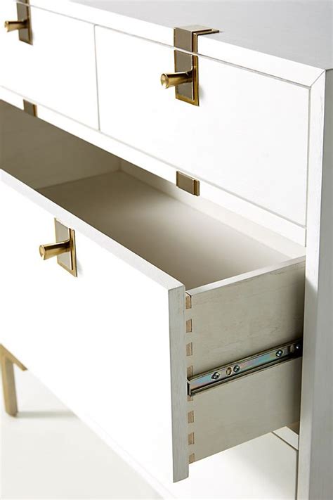 Defined by a textured anigre veneer façade and accented with stacked silver and brass hardware, our ingram collection is the epitome of contemporary luxury. Ingram Four-Drawer Dresser | Dresser drawers, Drawers ...