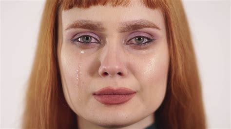Portrait Of Upset Crying Young Beautiful Female With Long Red Hair