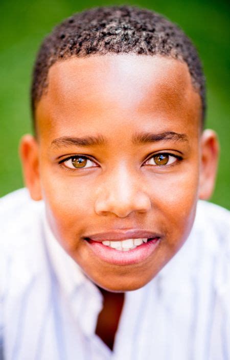 Portrait Of An African American Boy Smiling At The Park Freestock Photos
