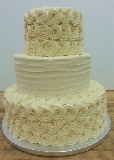 Gold Dragees And Buttercream Rosettes Make This Cake Stunning