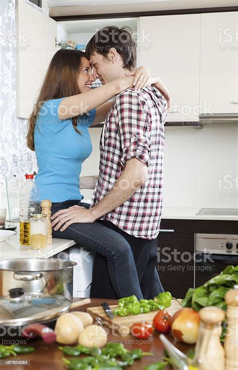 Loving Couple Having Sex At Table In Kitchen Stock Photo More