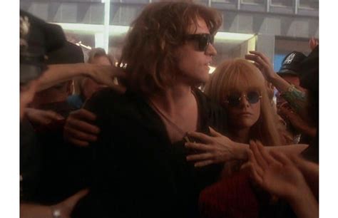 In The Doors Val Kilmer Playing Jim Morrison Wears Ray Bans That