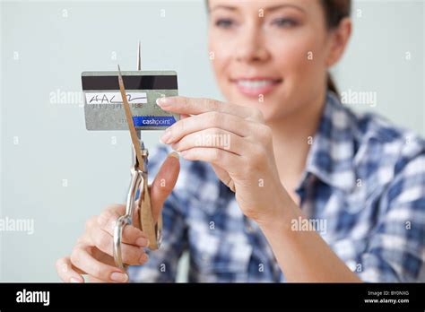 Young Woman Cutting Credit Card Stock Photo Alamy