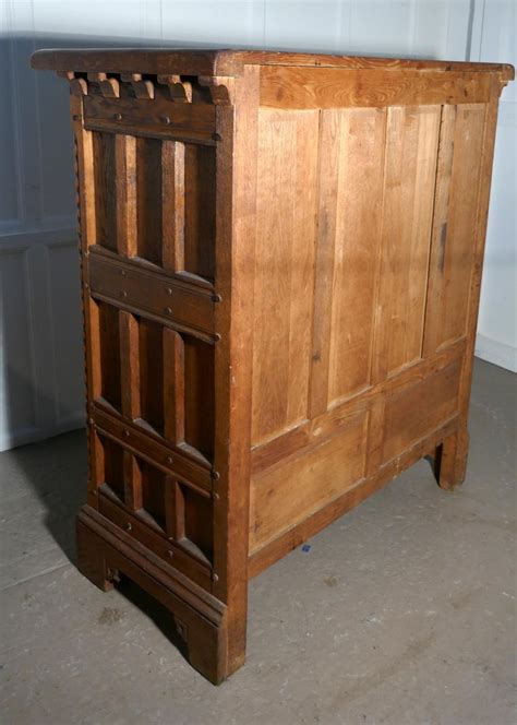 French Arts And Crafts Gothic Carved Golden Oak Cupboard For Sale At