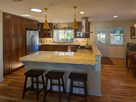 Since earth colors are warm neutrals, it looks good when the living room hardwood floors and wood beams bring a rustic charm to the space. Warm, Earthy Kitchen | Cheryl Balintfy | HGTV