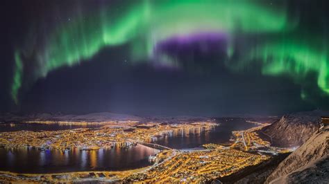 Northern Lights Dancing Over The City Of Tromsø Troms Northern Norway