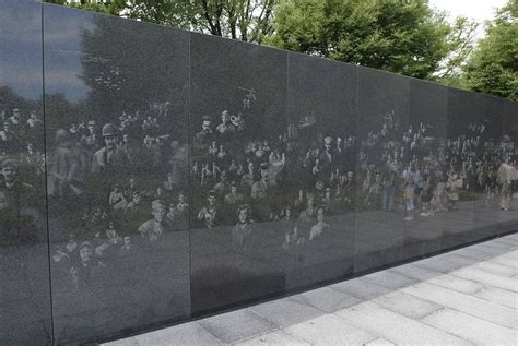 Tourists Visit The Korean War Veterans Memorial In Washington D C