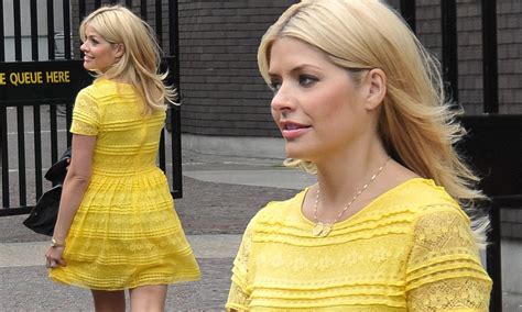 holly willoughby brightens up a dull day in a vivid yellow lace minidress but holds on to her
